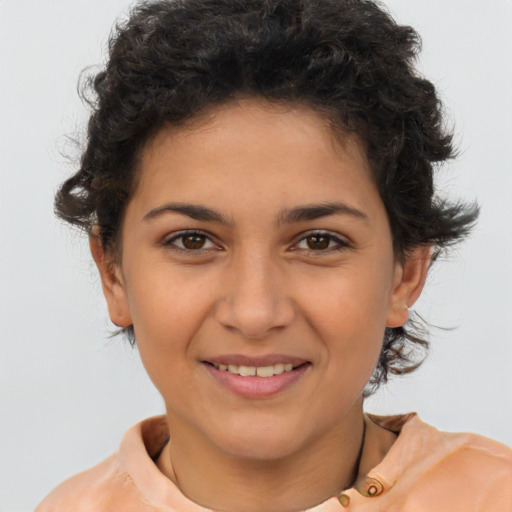 Joyful latino young-adult female with short  brown hair and brown eyes