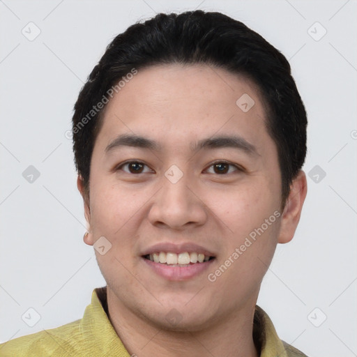 Joyful white young-adult male with short  black hair and brown eyes