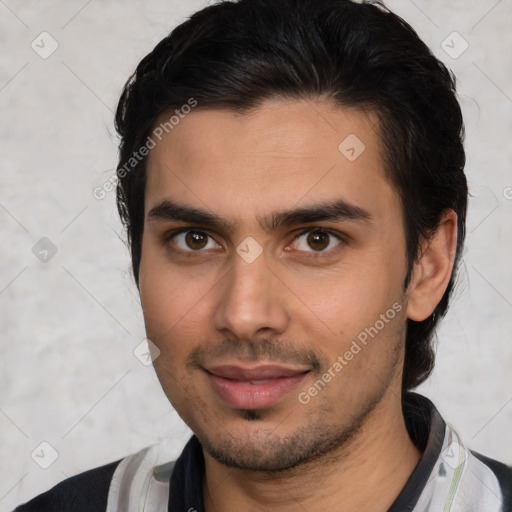 Joyful white young-adult male with short  black hair and brown eyes