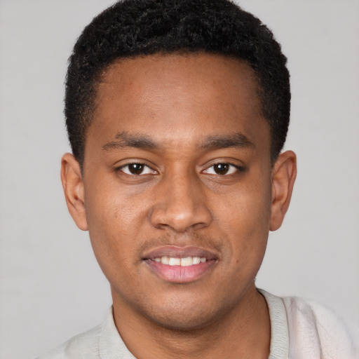 Joyful latino young-adult male with short  brown hair and brown eyes