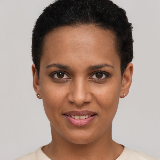 Joyful latino young-adult female with short  brown hair and brown eyes