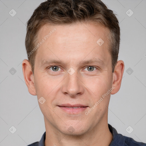 Joyful white adult male with short  brown hair and grey eyes