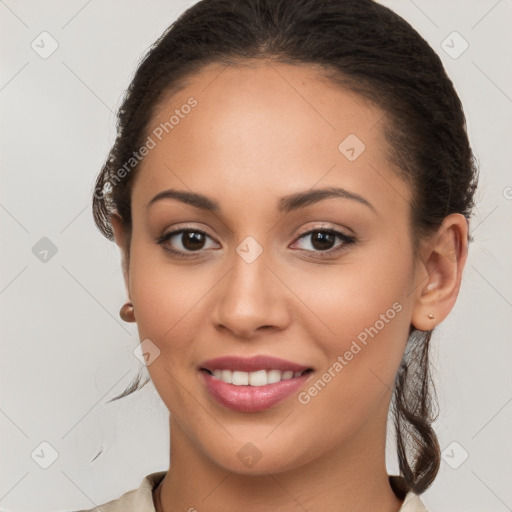 Joyful white young-adult female with long  brown hair and brown eyes