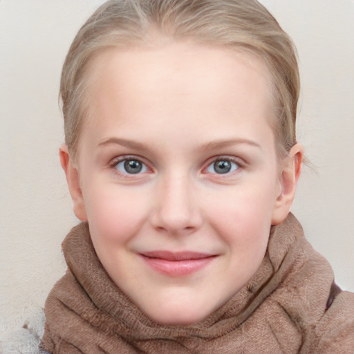 Joyful white child female with short  brown hair and blue eyes