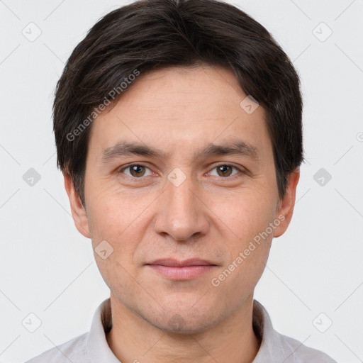 Joyful white adult male with short  brown hair and brown eyes