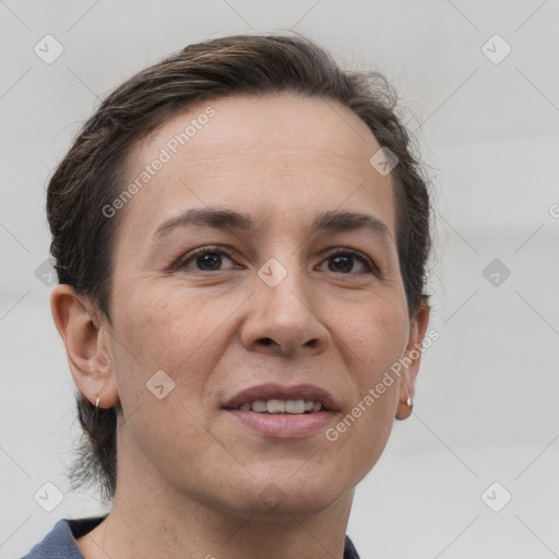 Joyful white adult female with short  brown hair and brown eyes