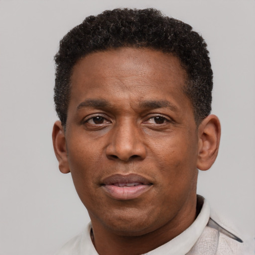 Neutral latino adult male with short  black hair and brown eyes