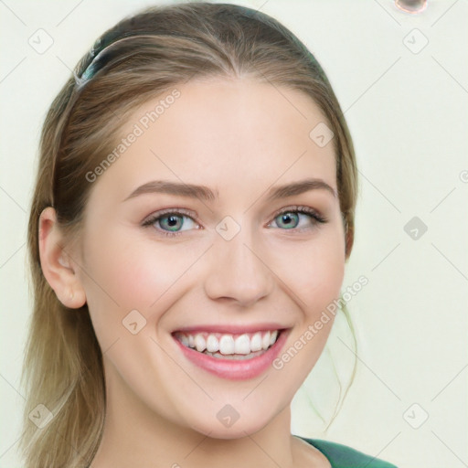 Joyful white young-adult female with long  brown hair and green eyes