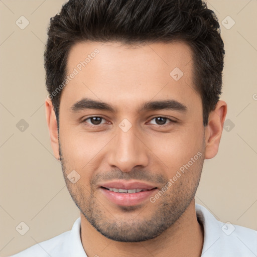 Joyful white young-adult male with short  brown hair and brown eyes