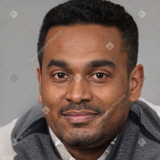 Joyful latino adult male with short  black hair and brown eyes