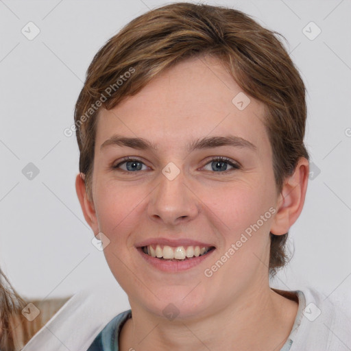 Joyful white young-adult female with short  brown hair and grey eyes