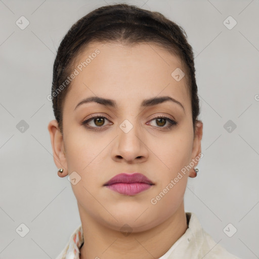 Joyful latino young-adult female with short  brown hair and brown eyes