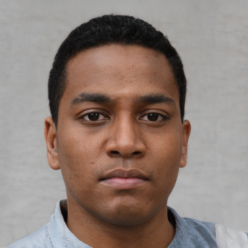Neutral black young-adult male with short  black hair and brown eyes