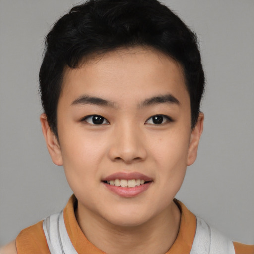 Joyful asian young-adult female with short  black hair and brown eyes