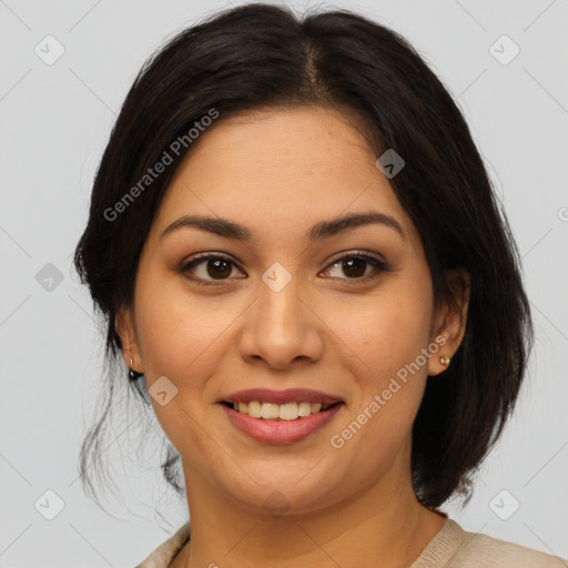 Joyful latino young-adult female with medium  brown hair and brown eyes