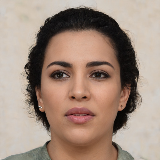 Neutral latino young-adult female with medium  black hair and brown eyes