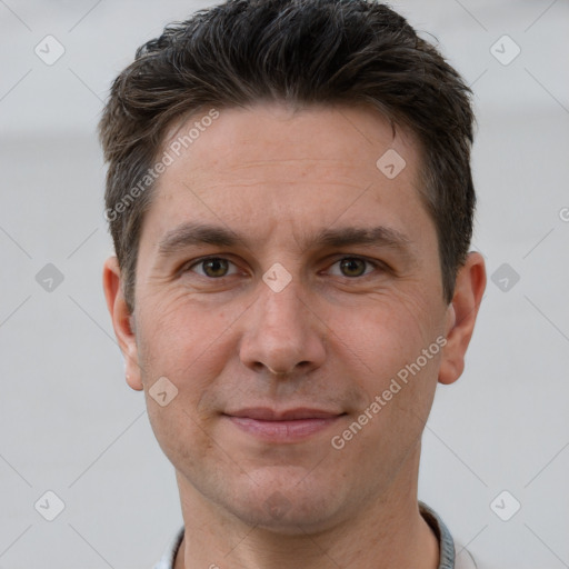 Joyful white adult male with short  brown hair and brown eyes