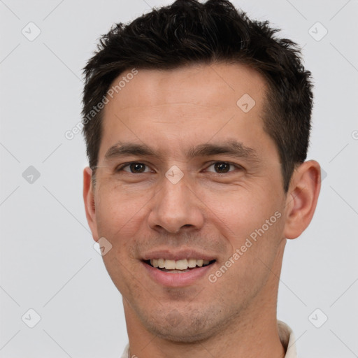 Joyful white young-adult male with short  brown hair and brown eyes