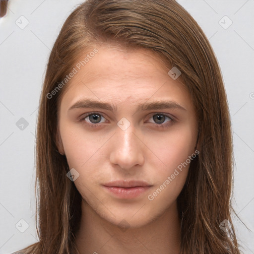 Neutral white young-adult female with long  brown hair and brown eyes