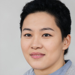 Joyful asian young-adult female with short  black hair and brown eyes