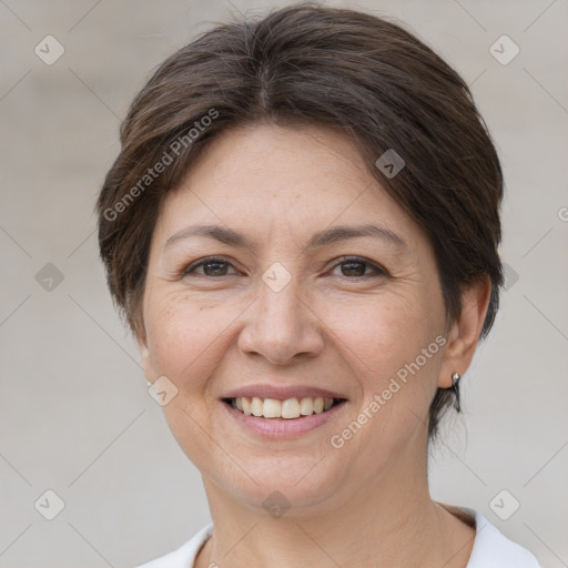 Joyful white adult female with medium  brown hair and brown eyes