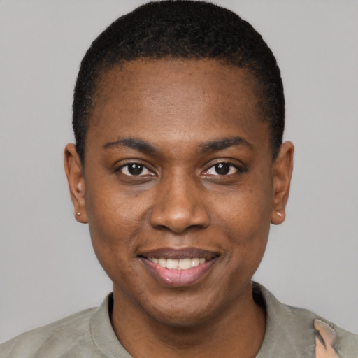 Joyful black young-adult male with short  black hair and brown eyes