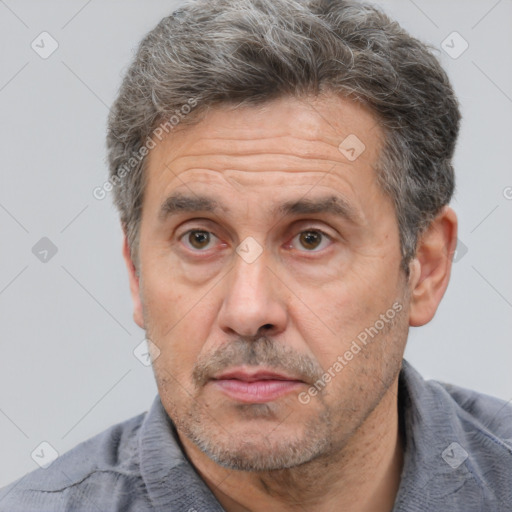 Neutral white middle-aged male with short  brown hair and brown eyes