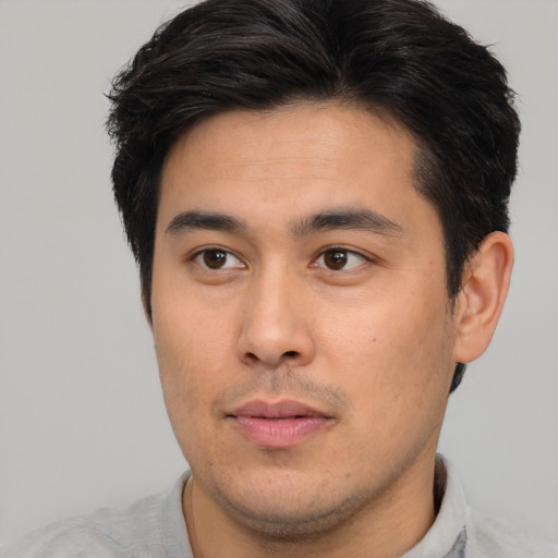 Neutral asian young-adult male with short  brown hair and brown eyes