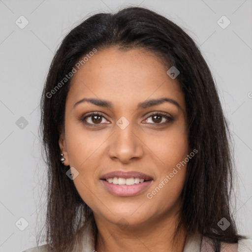 Joyful latino young-adult female with long  brown hair and brown eyes