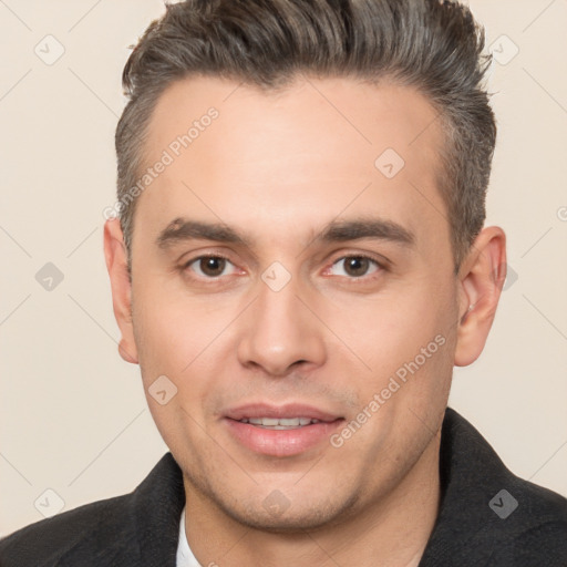 Joyful white adult male with short  brown hair and brown eyes