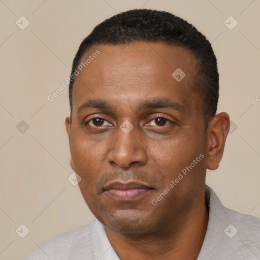 Neutral black young-adult male with short  black hair and brown eyes