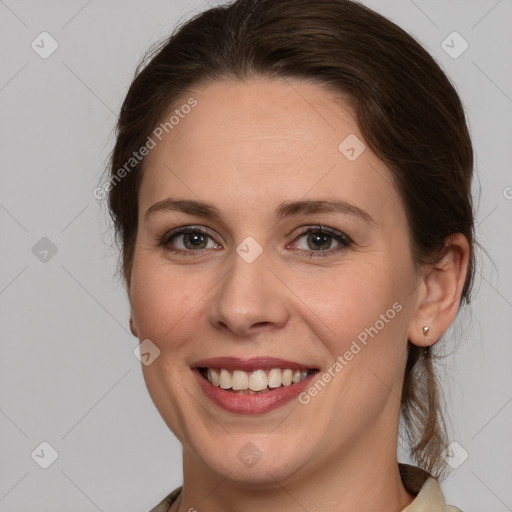 Joyful white young-adult female with medium  brown hair and brown eyes