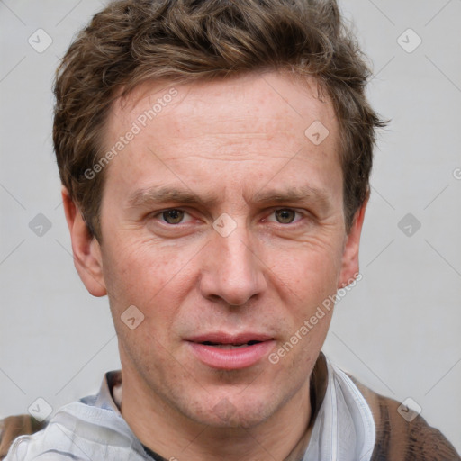 Joyful white adult male with short  brown hair and grey eyes