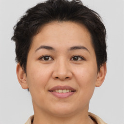 Joyful asian young-adult female with short  brown hair and brown eyes