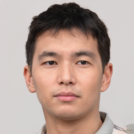 Neutral asian young-adult male with short  brown hair and brown eyes
