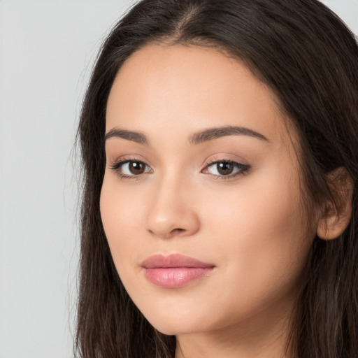 Neutral white young-adult female with long  brown hair and brown eyes