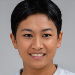 Joyful asian young-adult female with short  brown hair and brown eyes