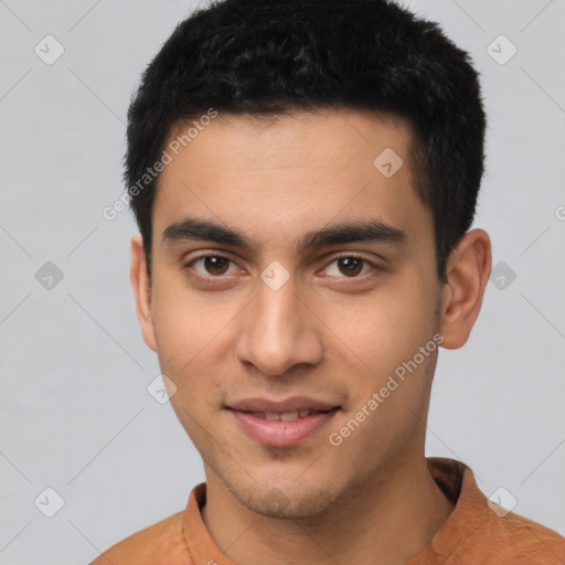 Joyful latino young-adult male with short  black hair and brown eyes