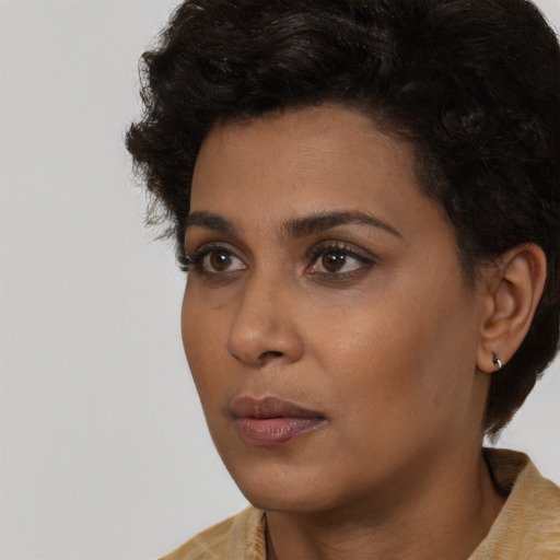Neutral black young-adult female with short  black hair and brown eyes