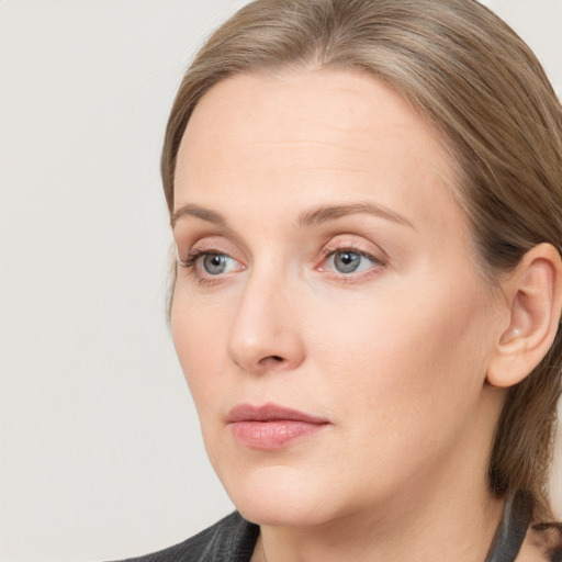 Neutral white young-adult female with medium  brown hair and grey eyes