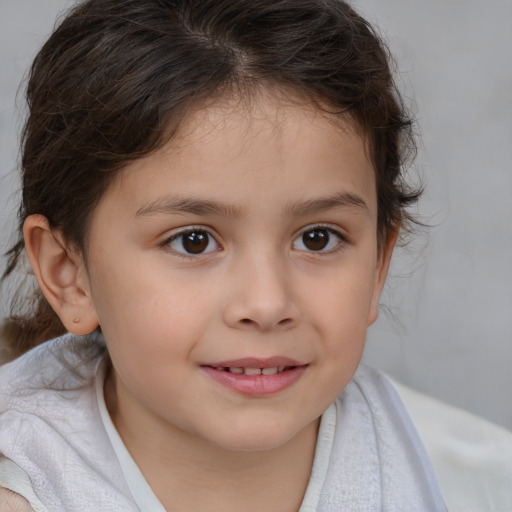 Joyful white child female with medium  brown hair and brown eyes