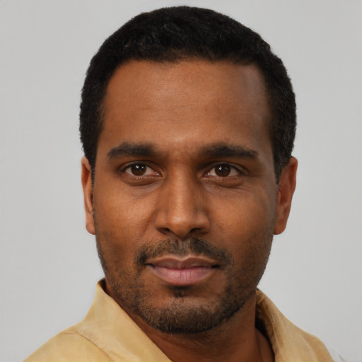 Neutral black young-adult male with short  black hair and brown eyes