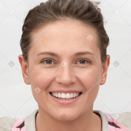 Joyful white young-adult female with short  brown hair and brown eyes