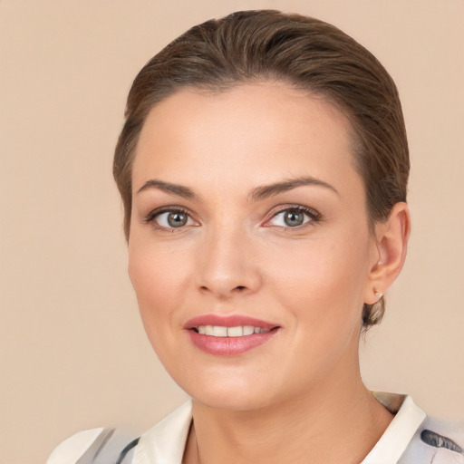 Joyful white young-adult female with medium  brown hair and brown eyes