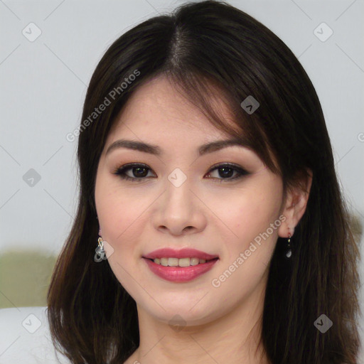 Joyful asian young-adult female with long  brown hair and brown eyes