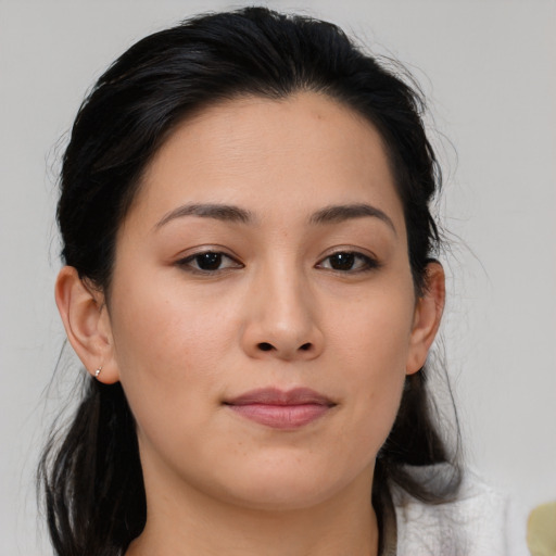 Joyful asian young-adult female with medium  brown hair and brown eyes