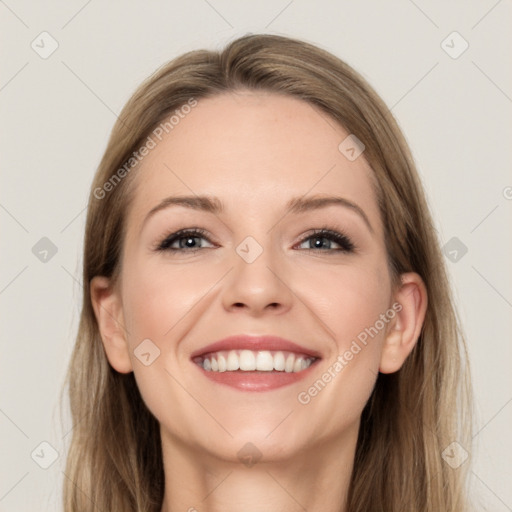 Joyful white young-adult female with long  brown hair and grey eyes