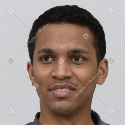 Joyful black young-adult male with short  black hair and brown eyes