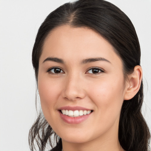 Joyful white young-adult female with long  brown hair and brown eyes