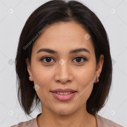 Joyful latino young-adult female with medium  brown hair and brown eyes